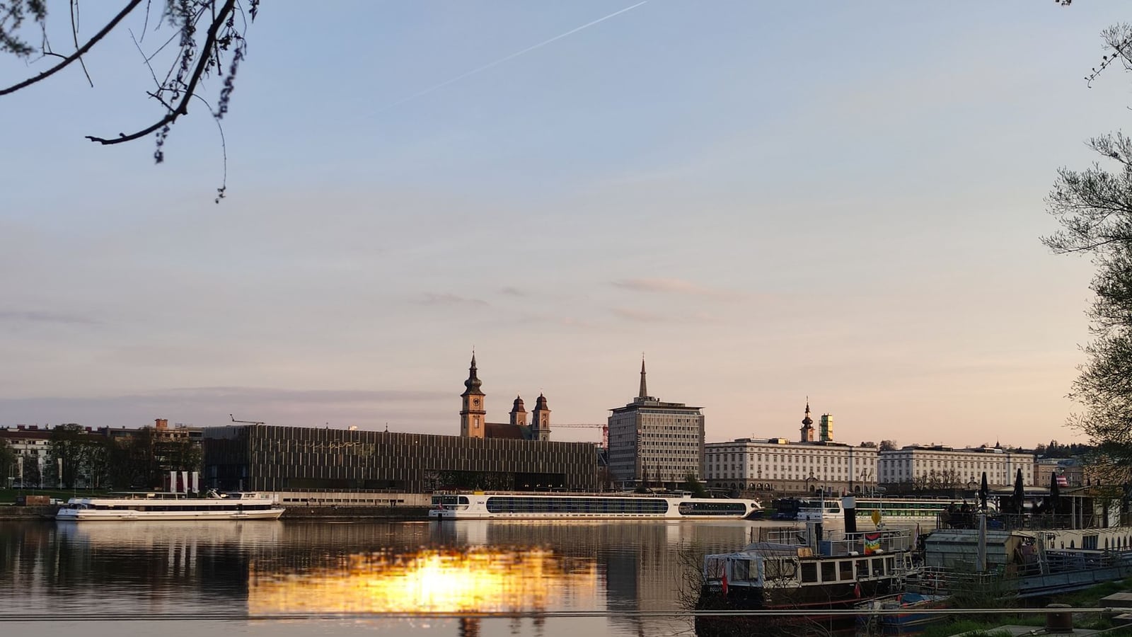 View of Linz city center with the Danube river in the background.